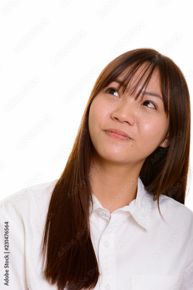 Portrait of young cute Asian teenage girl thinking Portrait of young cute Asian teenage girl thinking