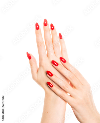 Woman hands with manicured red nails