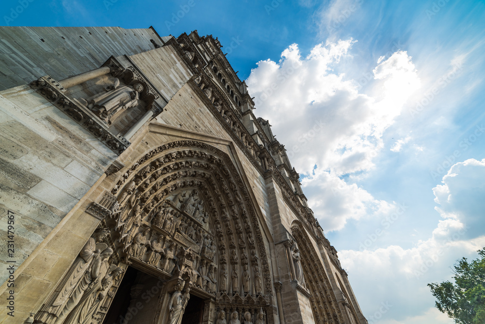 Notre Dame cathedral in Ile de la cite under a blue sky