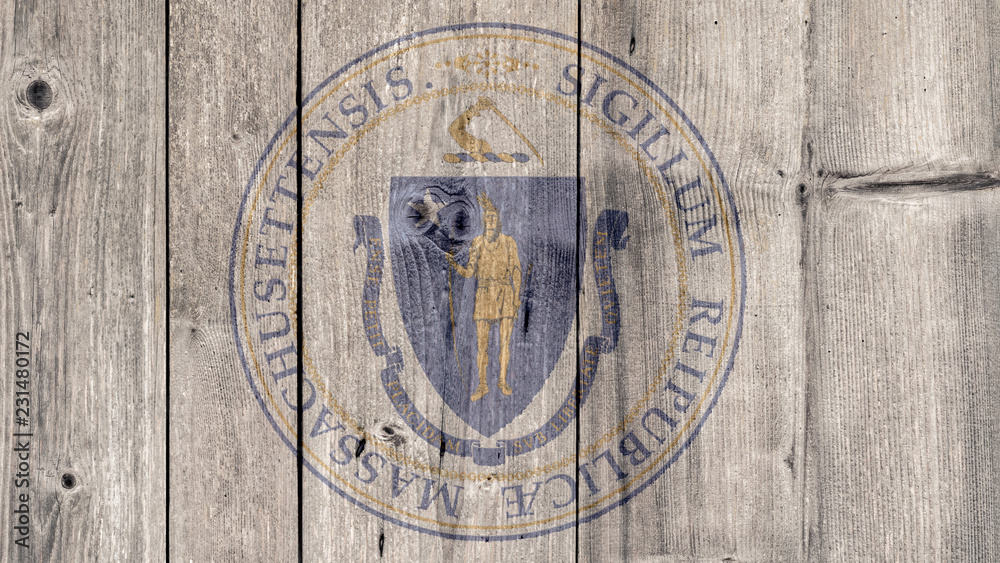 Obraz premium USA Politics News Concept: US State Massachusetts Seal Wooden Fence Background