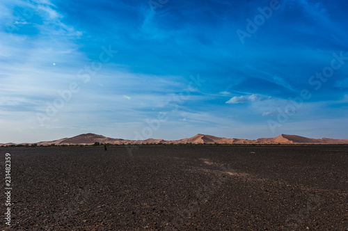 View of Merzouga dunes and black desert, southern Morocco