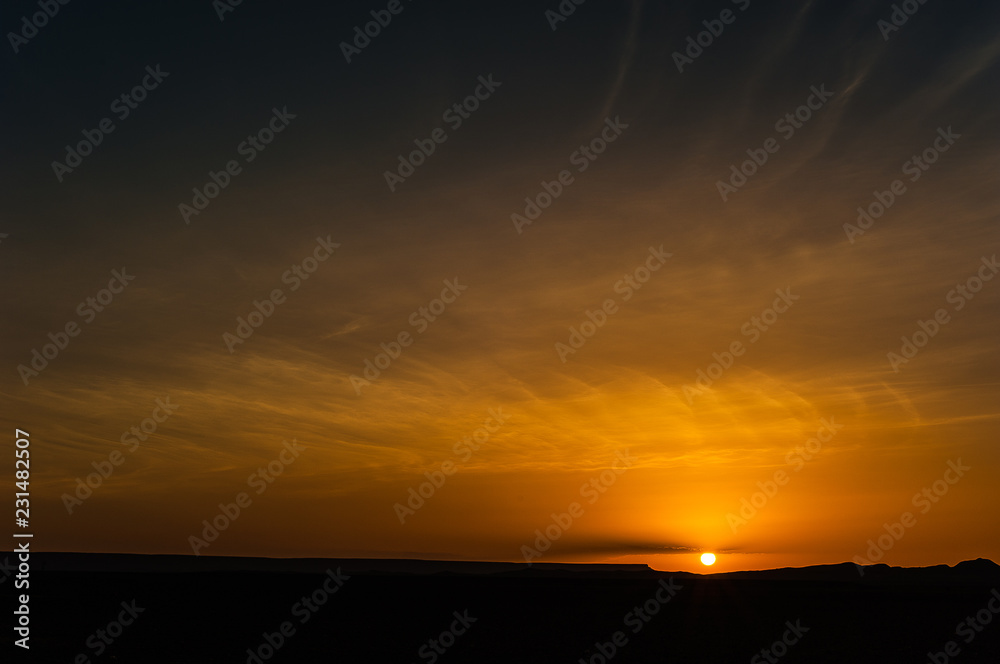 sunrise of black desert near Merzouga, Morocco