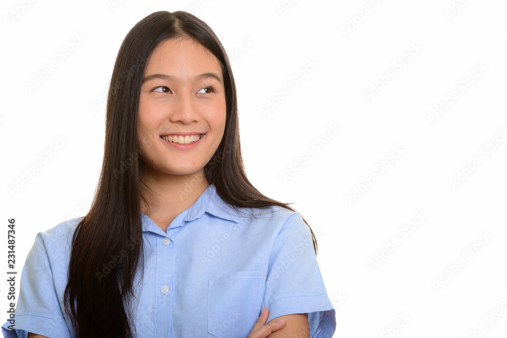 Young happy Asian woman smiling and thinking Young happy Asian woman smiling and thinking