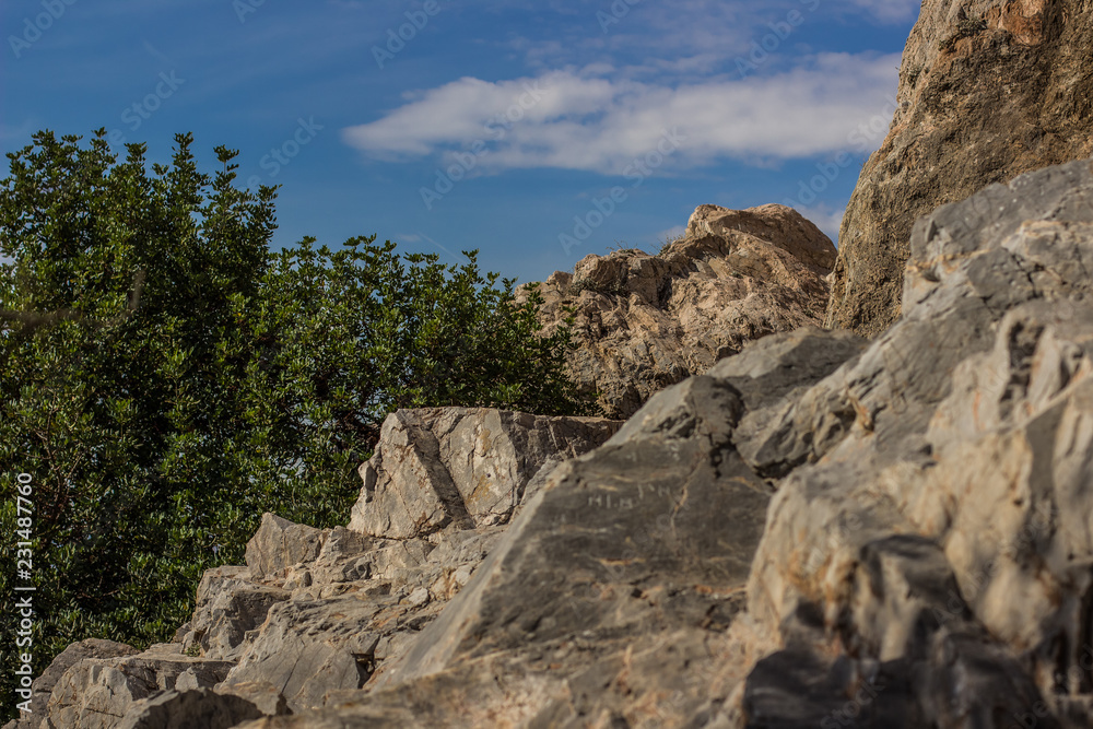 outdoor mountain forest local nature landscape of stone rocks on blue sky background in tropic Mediterranean district of Earth 