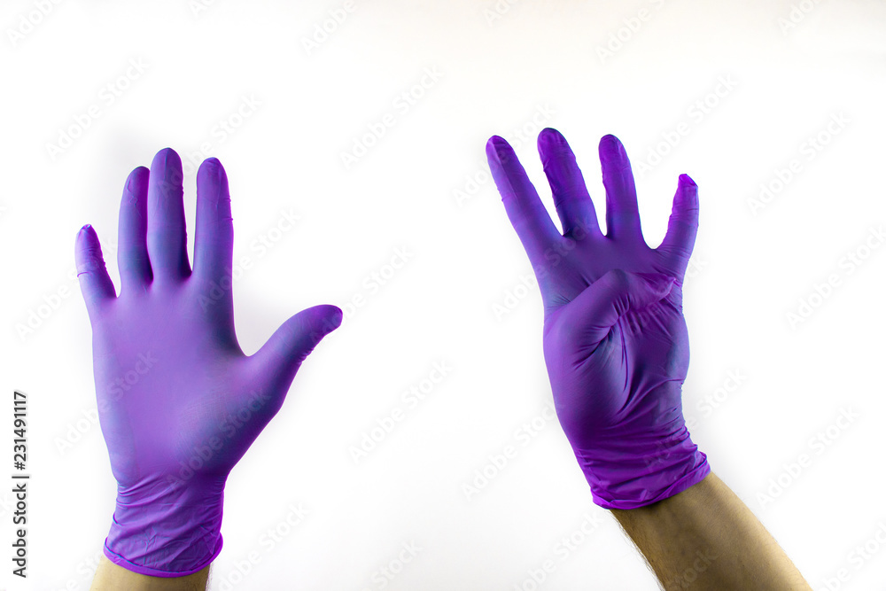 Obraz premium Male hand in medical glove on white background.