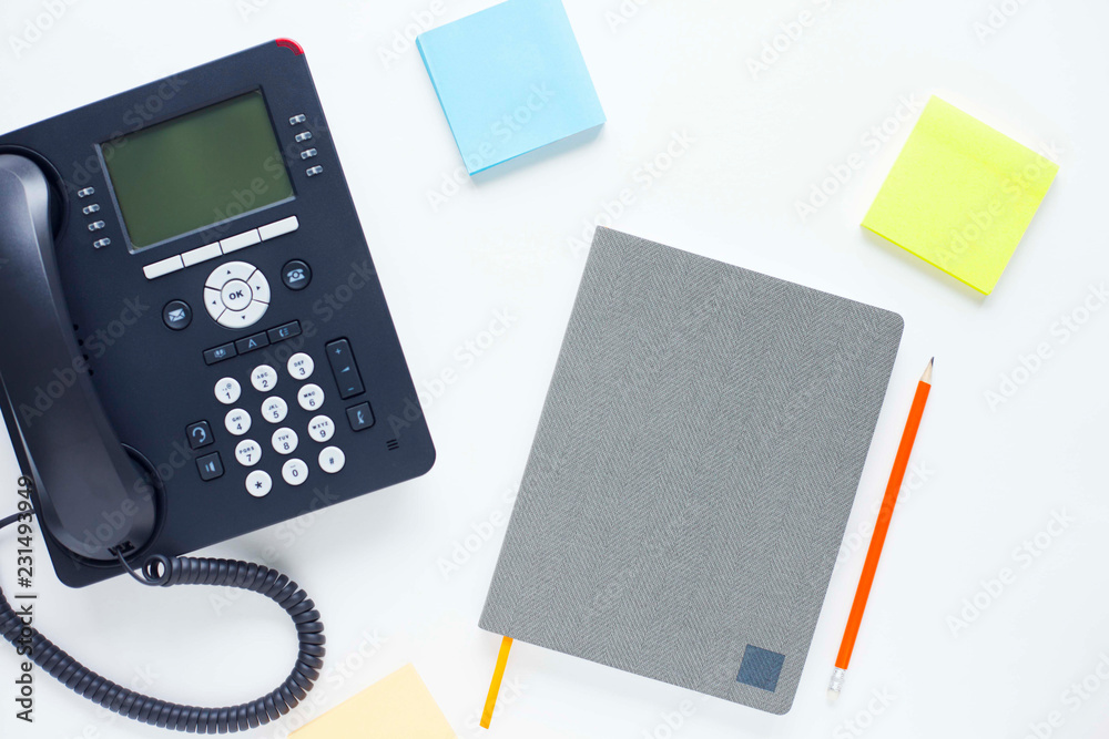 Deskphone, office and business concept. New ip phone with buttons and big display for communication without interference. Top view. Space for a text. Close up. Deskphone, office and business concept. New ip phone with buttons and big display for communication without interference. Top view. Space for a text. Close up.