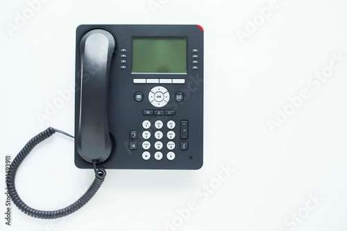 Deskphone, office and business concept. New ip phone with buttons and big display for communication without interference. Top view. Space for a text. Close up.