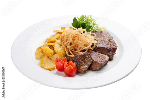 Veal liver with potatoes on a white plate
