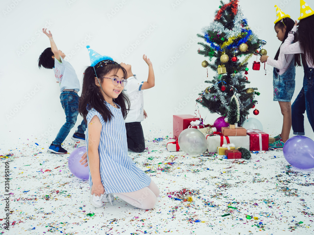 Fototapeta premium group of kids celebrate party and enjoy christmas fun together