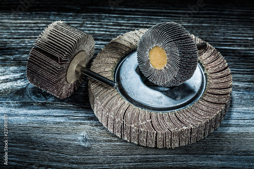 Photography Used rotary flap grinding wheels on vintage wooden board
