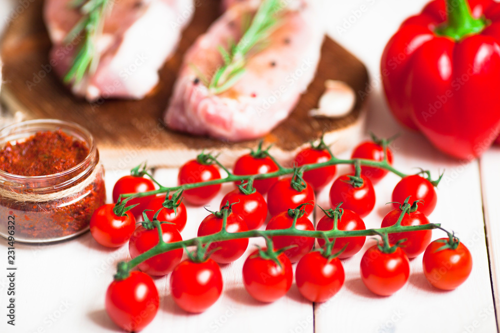 Fresh raw pork on the cutting board with ingredients for cooking. Food, flat lay, recipes and nutrition concept. Top view. Close up. Fresh raw pork on the cutting board with ingredients for cooking. Food, flat lay, recipes and nutrition concept. Top view. Close up.