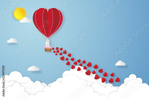  Paper art , cut and digital craft style of the lover in hot air balloons on blue sky and sunrise background as love , wedding, and valentine day concept. vector illustration