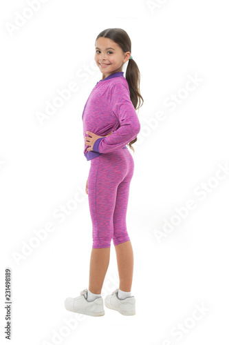 Sport for girls. Guidance on working out with long hair. Deal with long hair while exercising. Girl cute kid with long ponytails wear sportive costume isolated on white. Working out with long hair photo