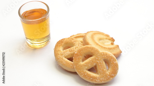 bicchierino di liquore e biscotti, shot of liqueur and biscuits photo