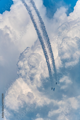 Military fighters fly in formation photo