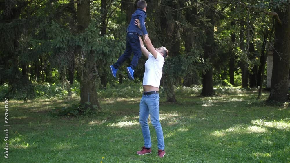 Dad playing with his son, throws him up and catch him. 4k. Slow Motion. Dad playing with his son, throws him up and catch him. 4k. Slow Motion.
