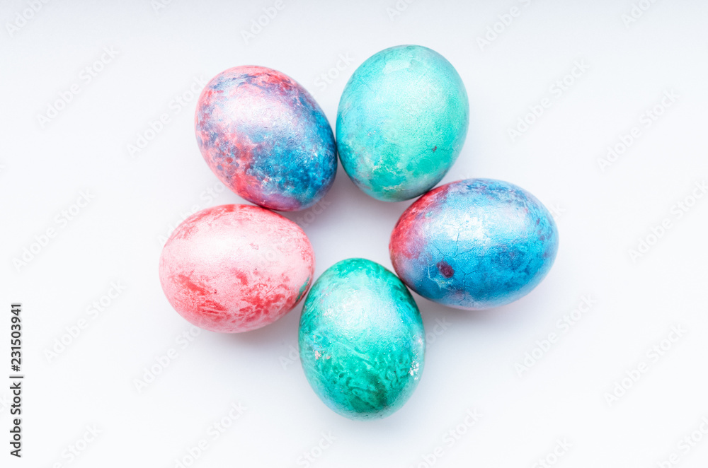 Flat lay of colourful bright easter eggs on a white background. Flat lay of colourful bright easter eggs on a white background.