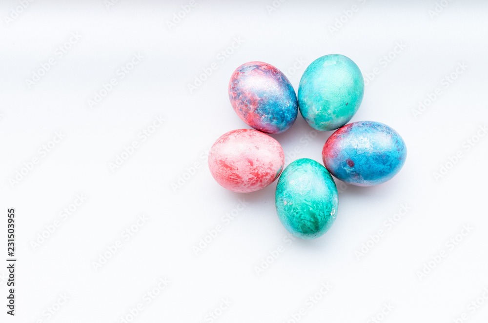 Flat lay of colourful bright easter eggs on a white background. Flat lay of colourful bright easter eggs on a white background.