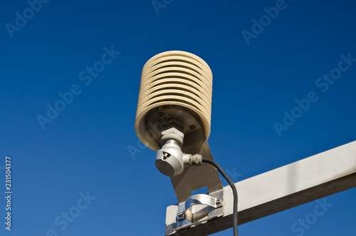 Temperature sensor in a meteo station on a blue sky