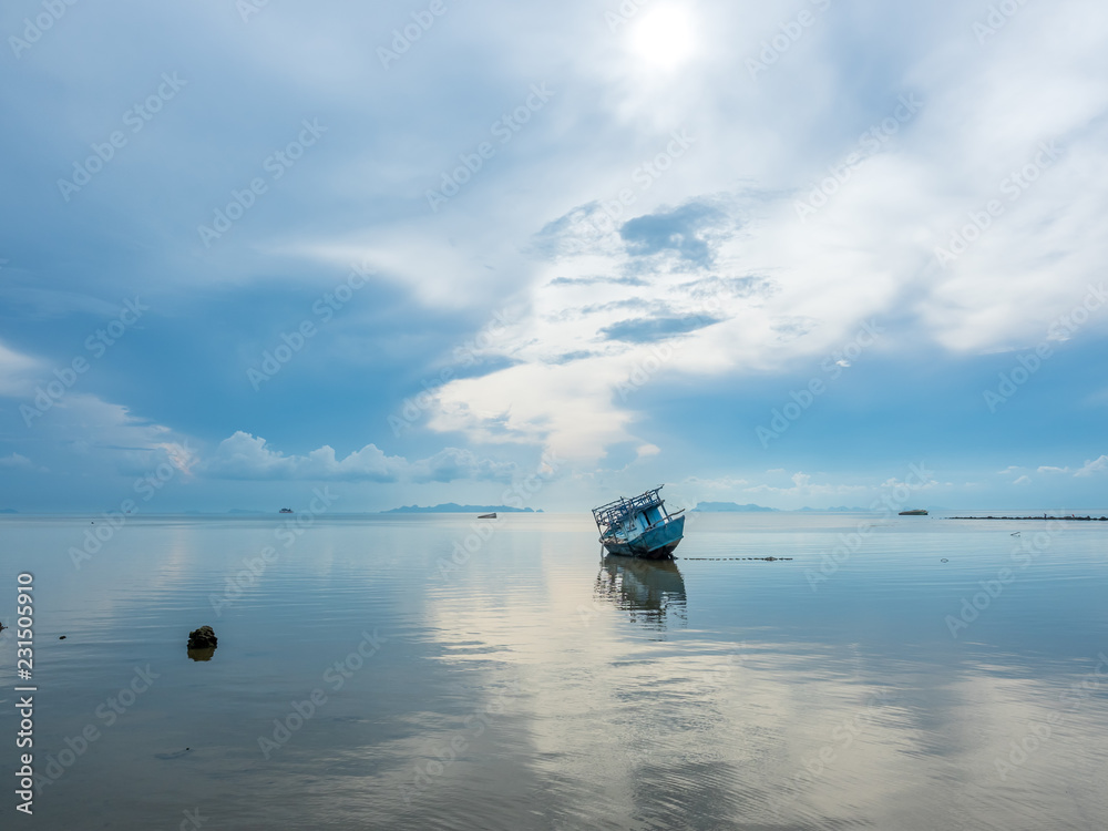 Fisherman boat aground over shallow water Fisherman boat aground over shallow water