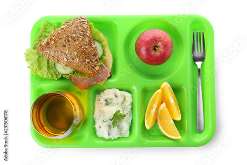 Serving tray with healthy food on white background, top view. School lunch
