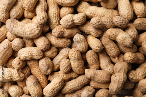 Dry peanuts in shell as background, top view. Healthy snack