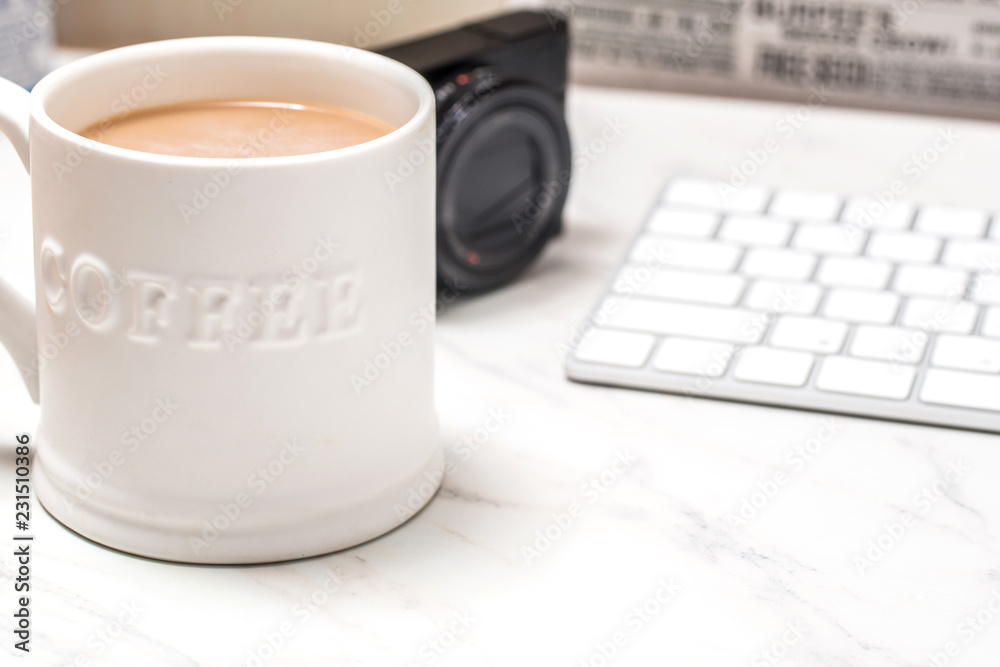 Office desk table with computer, supplies,analysis chart, coffee cup on wooden background. Top view with copy space Office desk table with computer, supplies,analysis chart, coffee cup on wooden background. Top view with copy space