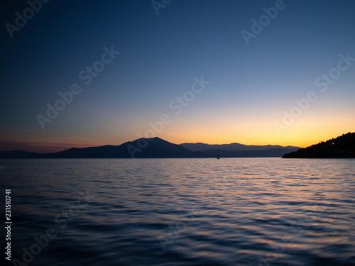 Moody sunset scenery of yachts taken at aegean sea in greece on the sporades Island - Skopelos, Alonisos, Skiathos © Rado
