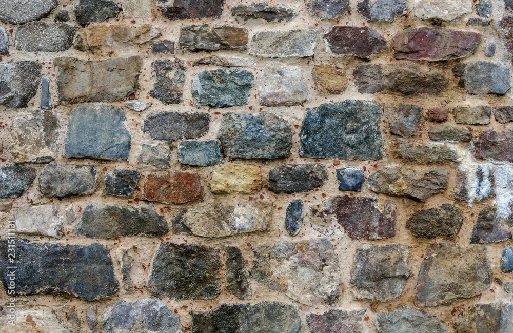 Texture of old stone wall. Clearly visible cobblestones. Texture of old stone wall. Clearly visible cobblestones.
