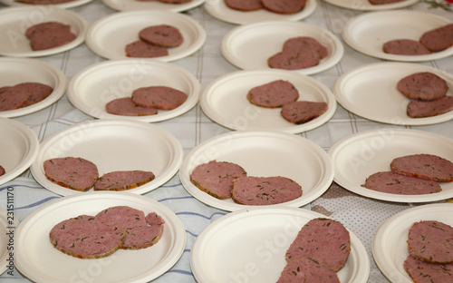 many plastic plates with slices of meatloaf