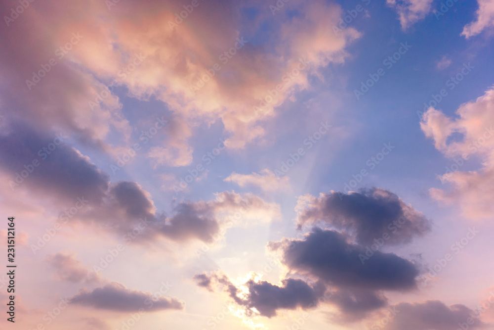 Fototapeta premium sunset / sun rise sky with rays of yellow and red light shining clouds and sky background and texture
