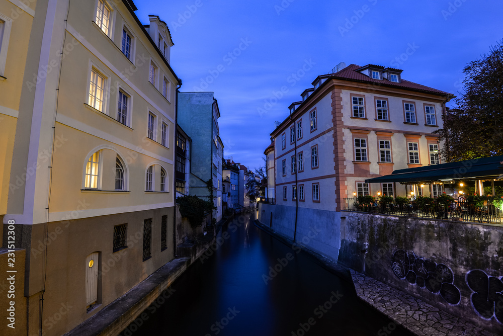 Night view on Certovka river and ancient buildings in Prague. Channel between Kampa island and Mala strana.