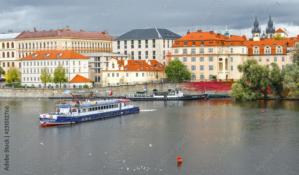Obraz premium Prague, Czech Republic - October 10, 2017: View on Old Town and Vltava river embankment, Prague, Czech Republic. Prague city center.
