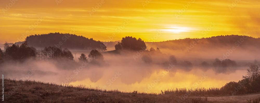 Misty, multicolored sunrise over  Lake in Poland