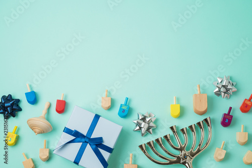 Jewish holiday Hanukkah background with menorah,  gift box and spinning top