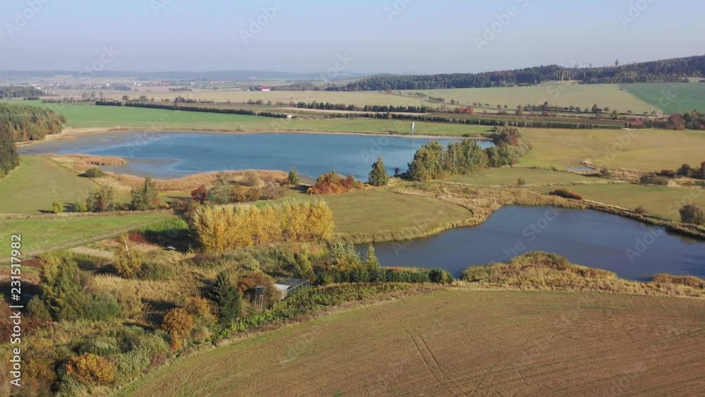 Aerial video of the small dam, reservoir in Europe with forest and fields in neighborough. Aerial video of the small dam, reservoir in Europe with forest and fields in neighborough.