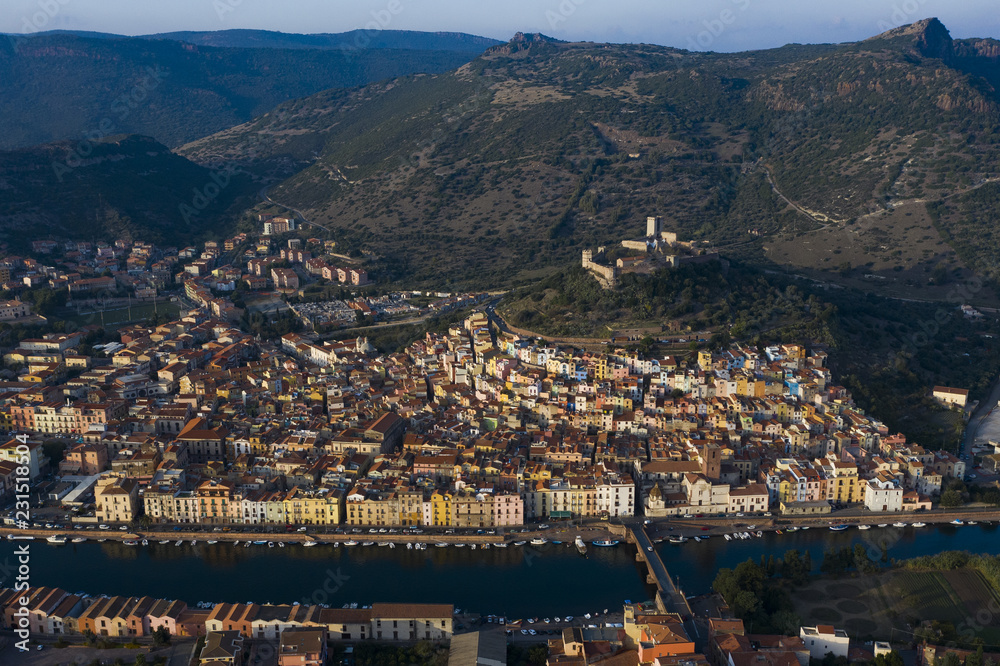 Naklejka premium Aerial view of the beautiful village of Bosa with coloured houses. Bosa is located in the north-west of Sardinia, Italy.