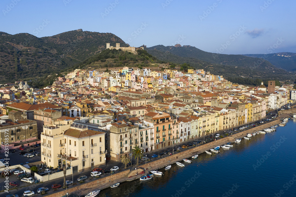 Naklejka premium Aerial view of the beautiful village of Bosa with coloured houses. Bosa is located in the north-west of Sardinia, Italy.