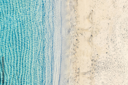 Aerial view of an amazing white beach with beautiful turquoise and transparent sea. Sardinia, Italy.