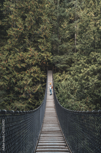 Girl on a suspension bridge