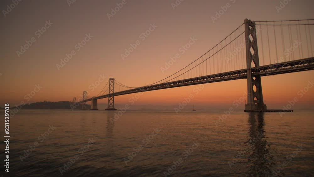 Low, Wide Angle Shot, San Francisco Bay Bridge at Sunset, towards Oakland Low, Wide Angle Shot, San Francisco Bay Bridge at Sunset, towards Oakland