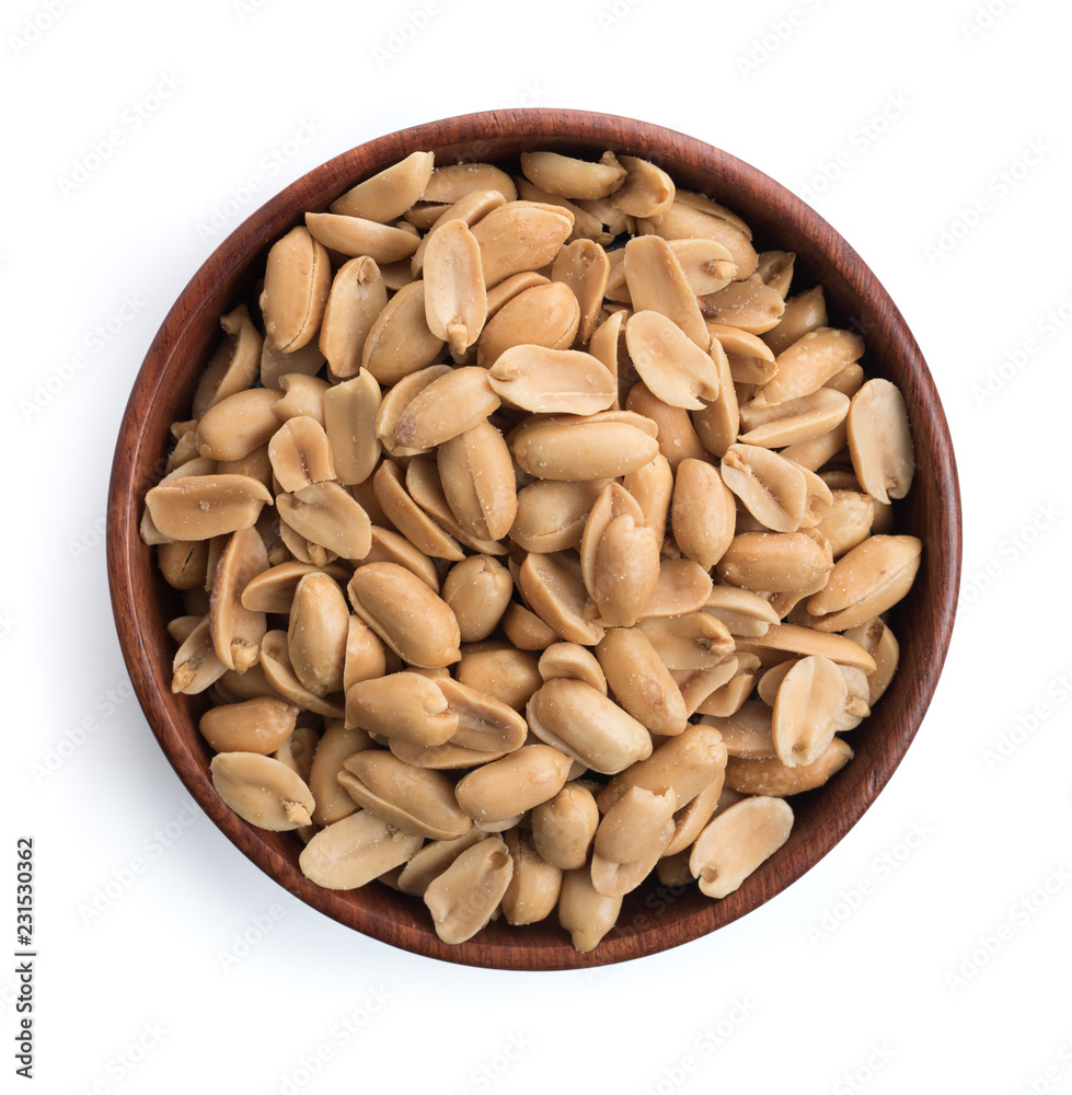 Roasted salted peanuts in wooden bowl on white background,top view Roasted salted peanuts in wooden bowl on white background,top view