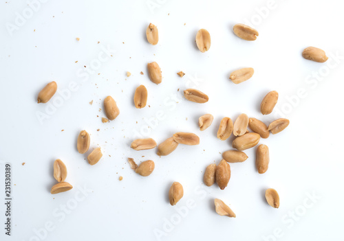 Roasted salted peanuts isolated on a white background photo