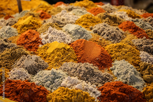 Piles of colourful mixed spices presented in layers at the bazaar of Isfahan, Iran. photo