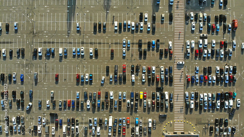 Aerial. Parking lot with hundreds of cars. Crowded car parking.