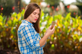 Young woman taking selfie on a smartphone