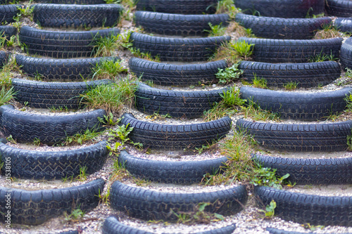 Old tires for steps in hillside