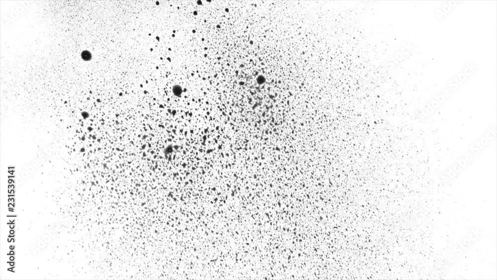 Black blots splashing on white surface Black blots splashing on white surface