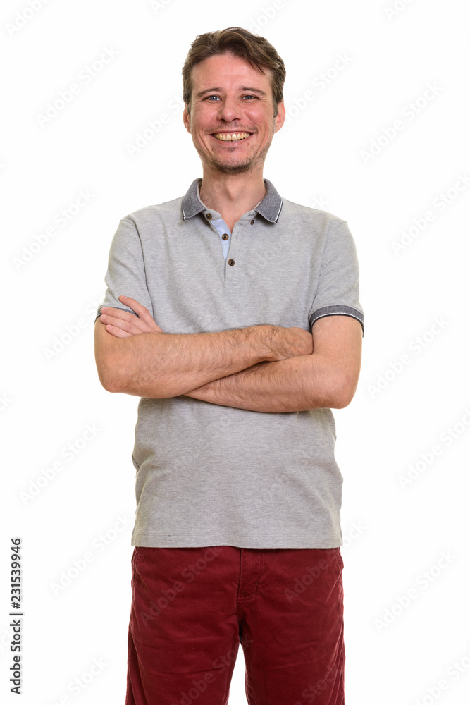 Happy Caucasian man smiling with arms crossed Happy Caucasian man smiling with arms crossed