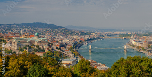 Panoramic view of Budapest and river Danube  in Hungary. The Castle of Buda is on the left and the bridge that spans river Danube is the famous Chain Bridge. Photo taken from the Gellert Hill.